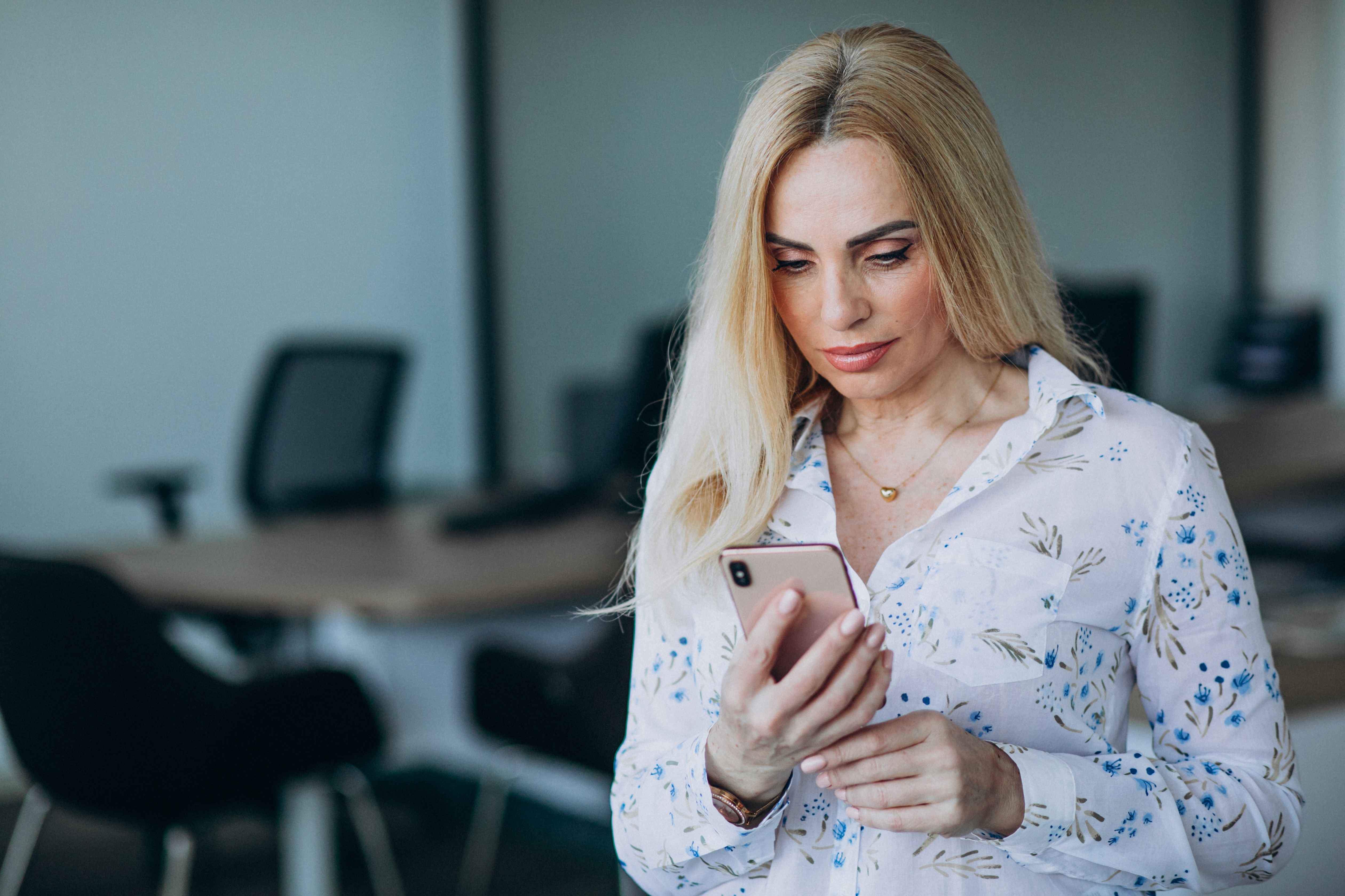 business-woman-office-using-phone.jpg