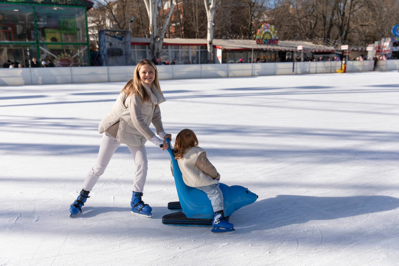 full-shot-happy-mother-with-girl-rink_23-2149344302.jpg